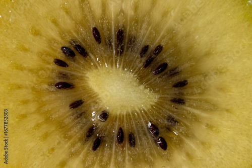  closeup of golden kiwi sliced in half 