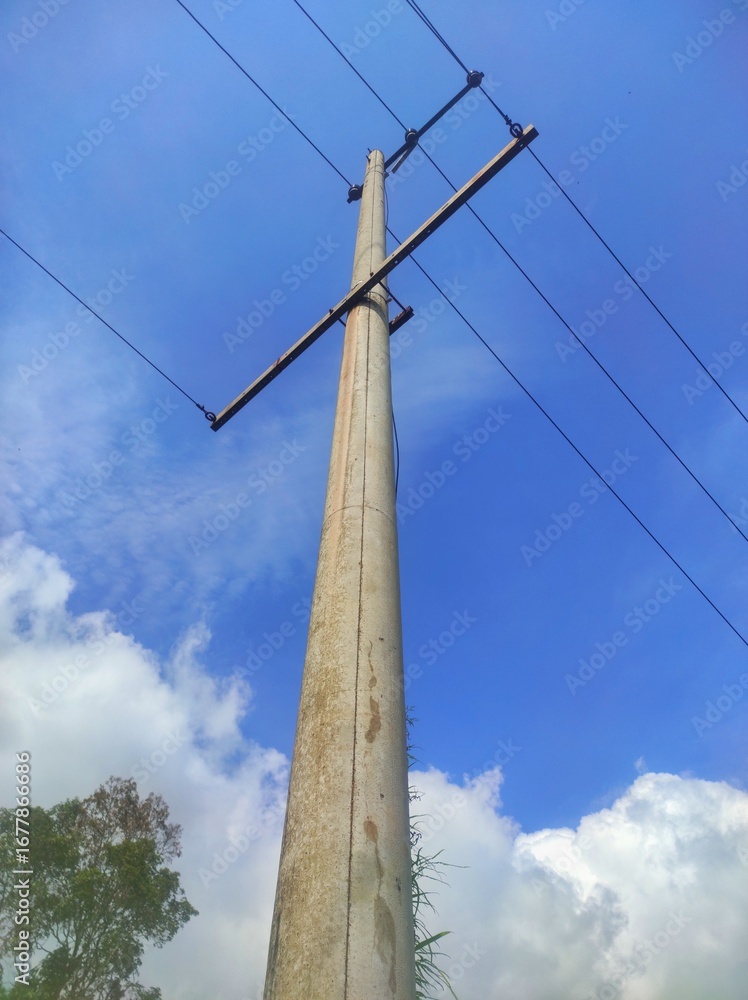 Obraz premium Utility Pole with Power Lines on a Clear Day