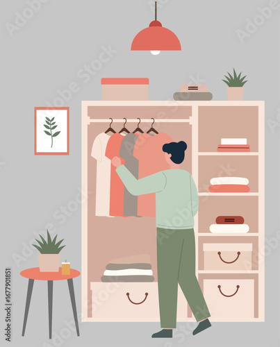 A person selects clothing from a tidy, well-organized closet, illustrating daily routine, choice, and a minimalist lifestyle in a cozy home interior