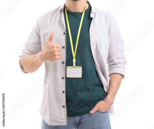 Young man with blank badge ...