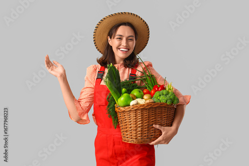 Female farmer with basket o...