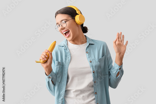 Young woman in headphones w...