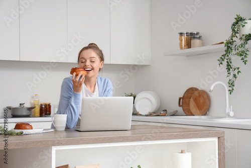 Young woman with modern lap...