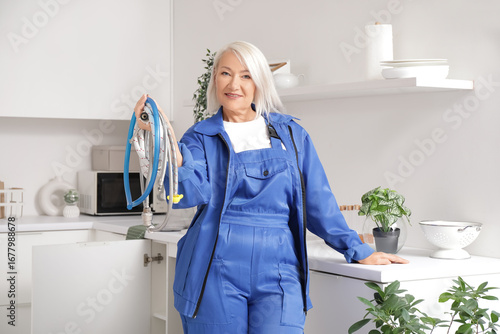 Mature female plumber with ...