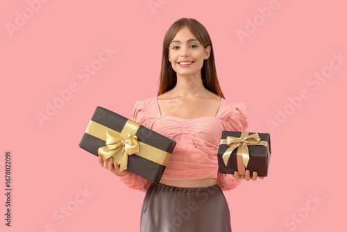 Young woman with gift boxes...