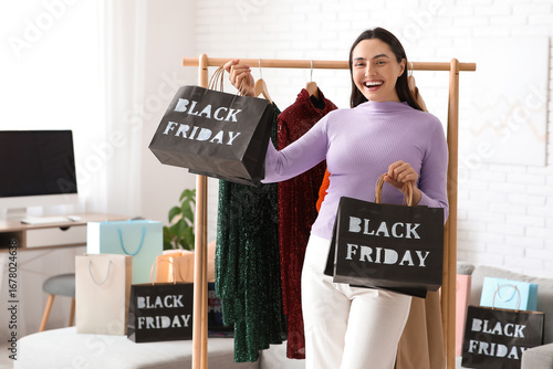 Happy young woman with shop...