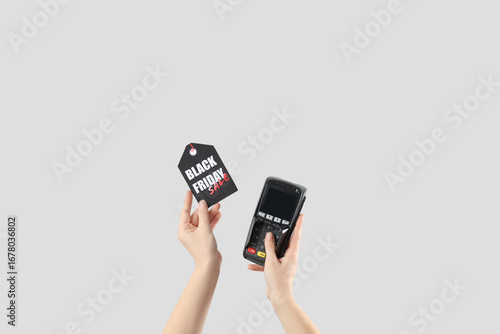 Woman holding payment termi...