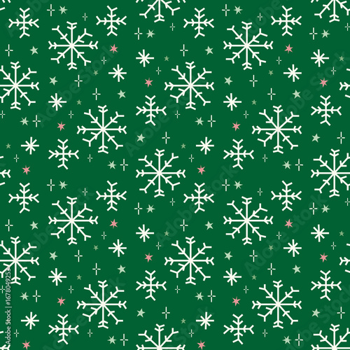Snowflake seamless Christmas pattern on green background with stars