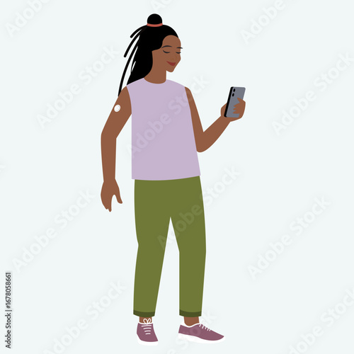 Full length portrait of young woman wearing continuous glucose monitor attached to the upper part of her arm, checking records in smartphone application