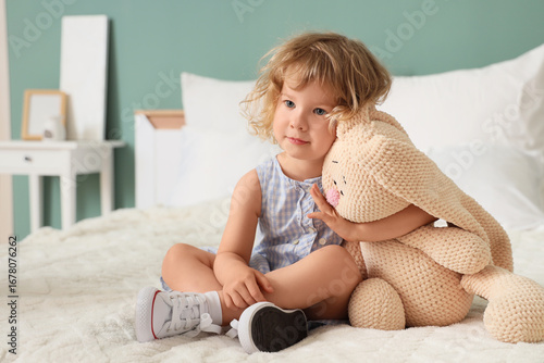 Cute little girl with toy b...