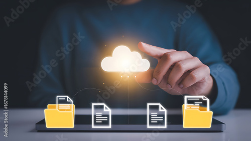Person touching glowing cloud symbol with digital files and folders representing cloud computing data storage