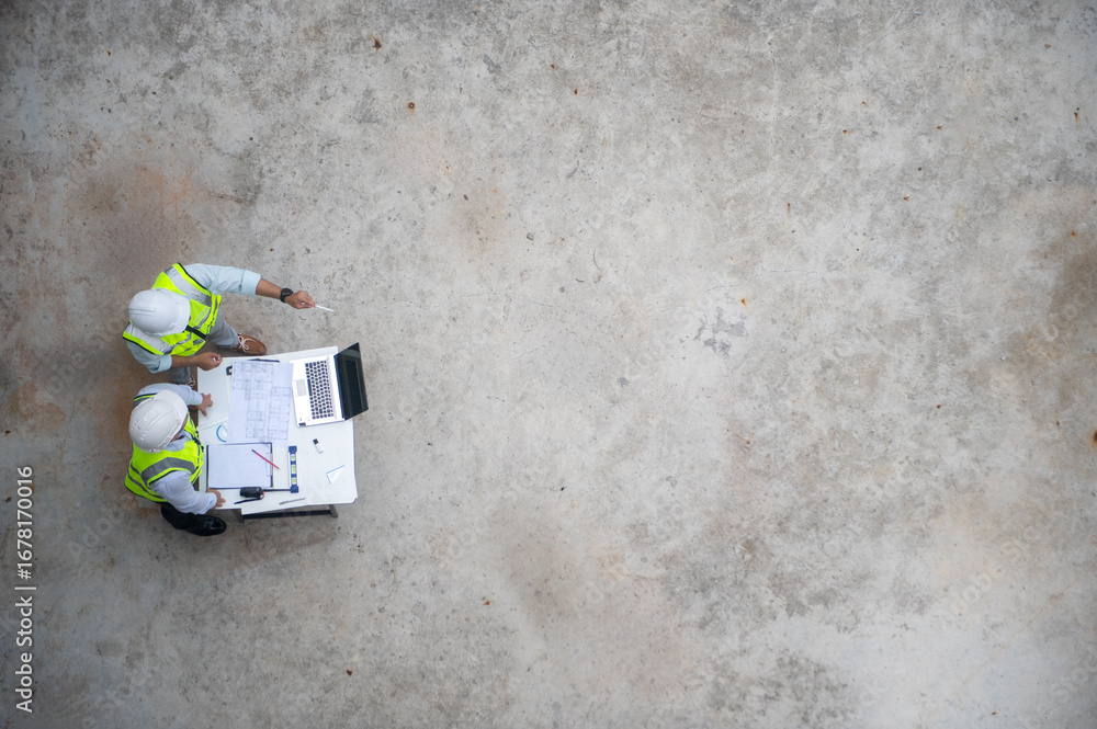 Obraz premium Architect and engineer are planning the construction of buildings according to blueprints