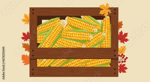 Wooden crate brimming with vibrant yellow corn cobs surrounded by colorful autumn leaves