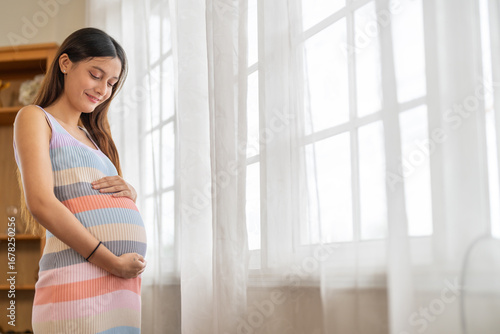 Happy smiling Mother woman hugging and smiling expecting with pregnancy hold baby in belly, woman pregnant, birth, preparation, maternity, care with childbirth at home.Love of family Free Download Happy smiling Mother woman hugging and smiling expecting with pregnancy hold baby in belly, woman pregnant, birth, preparation, maternity, care with childbirth at home.Love of family - GFXLoad