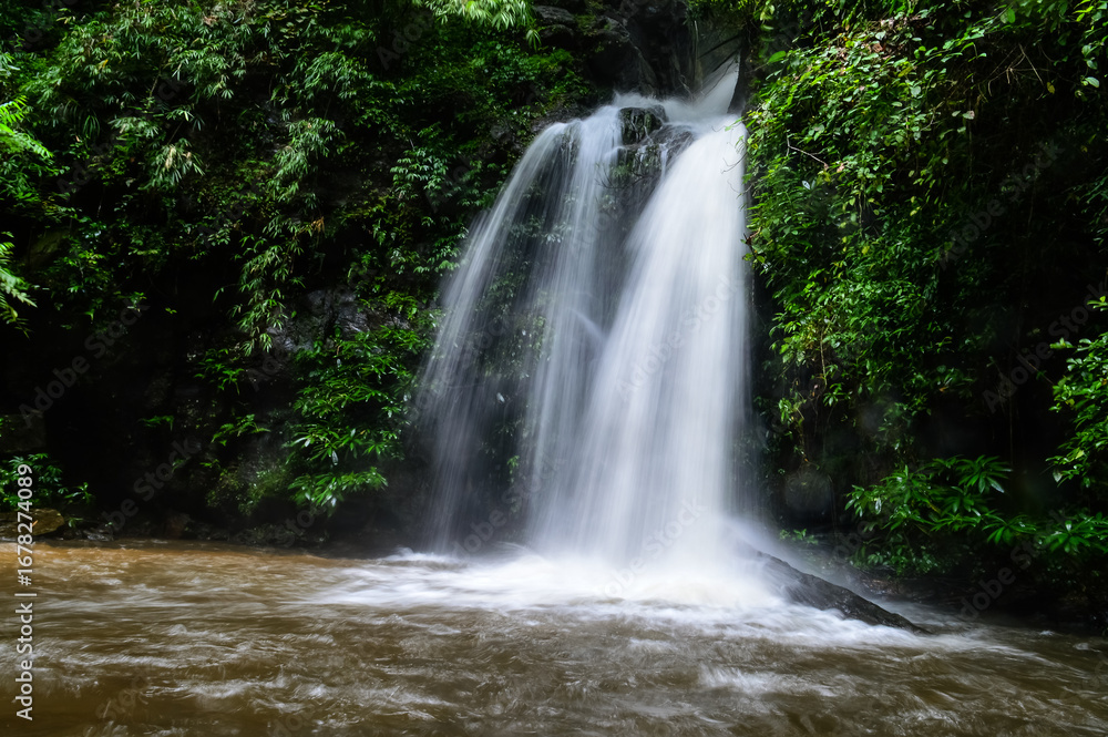 Obraz premium Mon Tha Than Waterfall or Montha Than Waterfall in the rainy season at Doi Suthep-Pui National Park,Chiang mai, Northern Thailand.