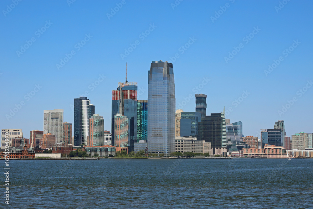 Obraz premium Jersey City and New Jersey skyline seen from the Hudson River with the Goldman Sachs skyscraper other modern buildings