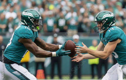 A professional  American football player receives a handoff from his white teammate on the field. This image represents teamwork, collaboration, and diversity in sports.