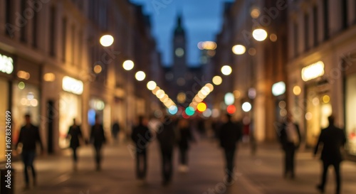 Wallpaper Mural Blurred evening street scene with pedestrians, illuminated storefronts, and distant buildings. Torontodigital.ca