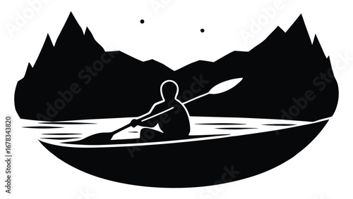 Silhouette of a kayaker on a lake surrounded by mountains at night