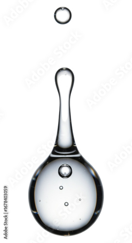 Clear liquid droplet forming a crown shape isolated on transparent background