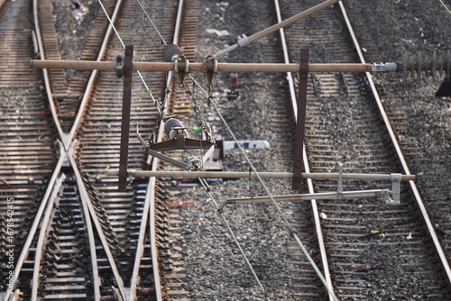 Closeup of railway crossing overhead wire fitting and electrification system