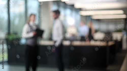 A blurry image of a group of people in a room