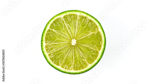 Lime slice showing juicy pulp and vibrant green rind on white surface