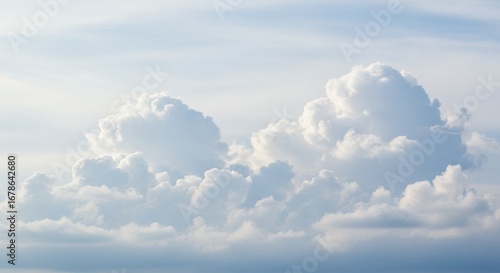 Fluffy white clouds soft pastel sky background