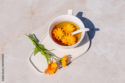 Herbal tea with vibrant marigold flowers