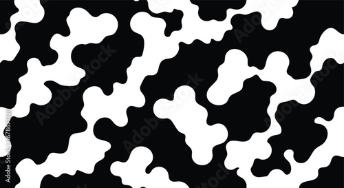 Abstract black and white pattern resembling cowhide, creating a textured background.