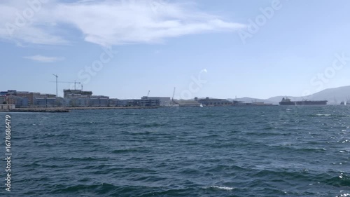 Pan from the Algeciras bay towards the rock of Gibraltar, as seen from La Linea de la Concepcion in Spain.