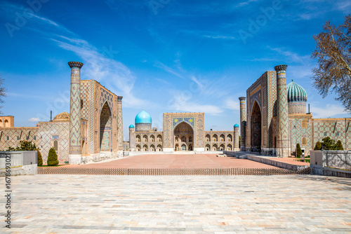Registan Square in Samarkand, Uzbekistan, a historic architectural ensemble featuring three stunning madrasas. In old arabic God is great on the walls