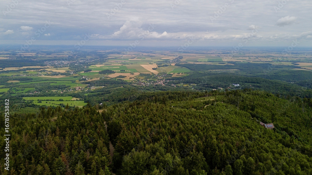 Fototapeta premium Opawskie Mountains, Poland. View from the summit to the mountain valley of the Czech Republic and Poland.