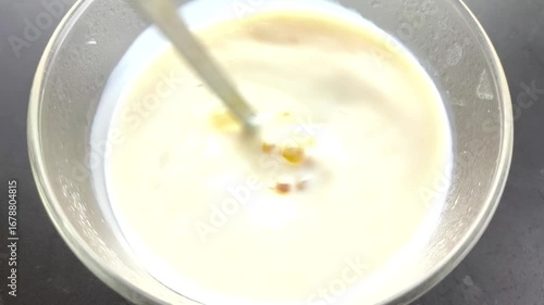 Mixing turmeric powder with milk, in door Chiangmai Thailand.