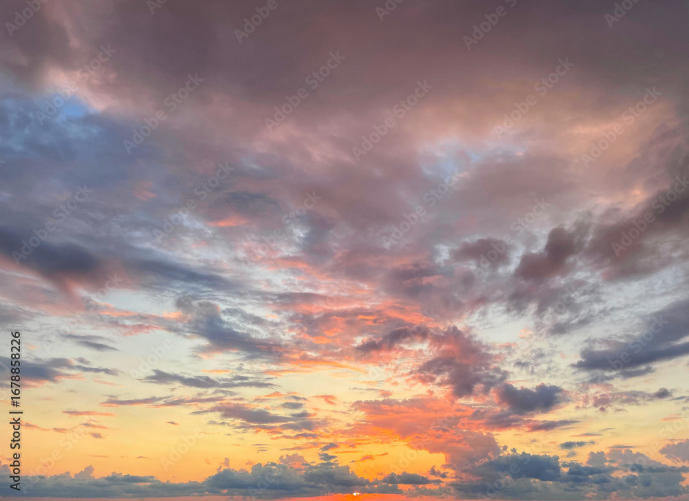 Fototapeta premium Fantastic sky. Bright landscape with sky, sun and gold, red and dark clouds