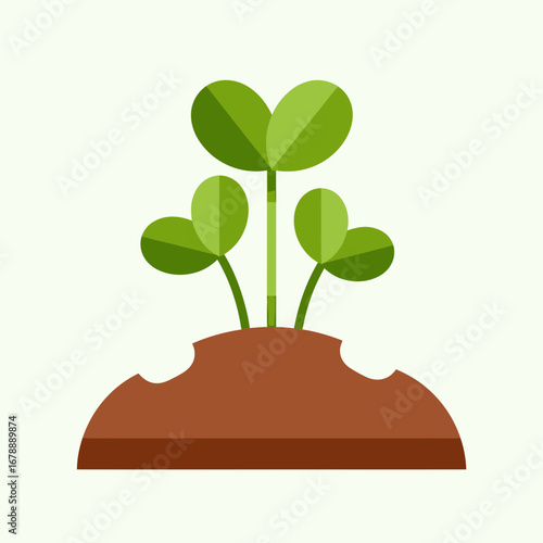 Green sprouts emerging from brown soil against a light background.