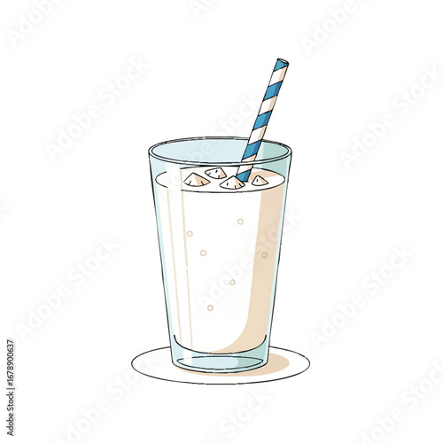 Refreshing glass of creamy milk with ice and a striped straw ready for a cool delicious drink