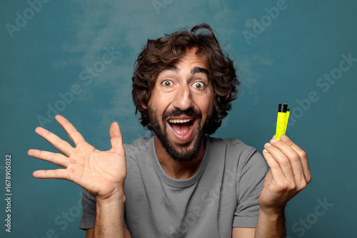 young adult bearded man with a lighter