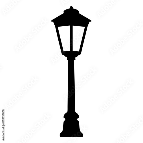 Silhouette of a vintage street lamp provides nighttime illumination and atmosphere