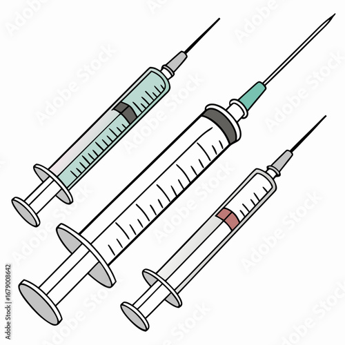 Three medical syringes with needles and liquid inside arranged diagonally on a white background