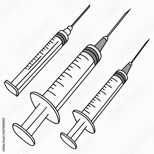 Three medical syringes with needles displayed at different angles against a white background