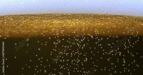 Slow Motion Abstract Macro Of Dark Golden Liquid With Foam And Rising Bubbles, Carbonated Texture Background For Drinks, Refreshment, Celebration And Creative Beverage Concept At 1000 Fps
