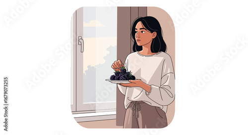 Young Woman Holding a Plate Of Blackberries Near a Window In The Morning