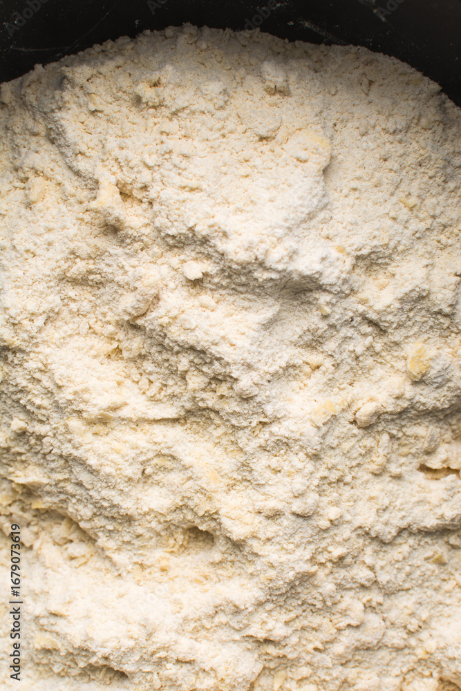 Obraz premium Raw chin-chin dough being mixed, process of making chin chin achomo or klenat
