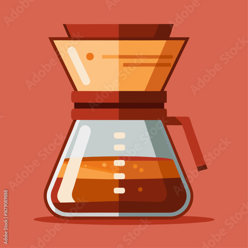 A coffee maker with a cup of coffee next to it. The coffee maker is a glass carafe with a handle
