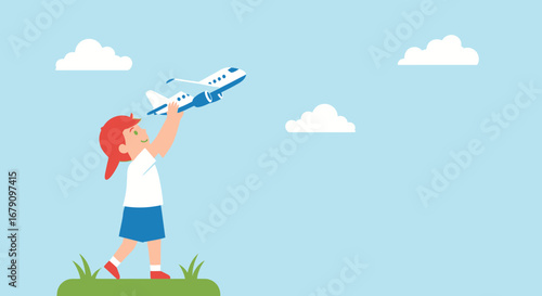 Young child playing with a toy airplane in the park on a beautiful day