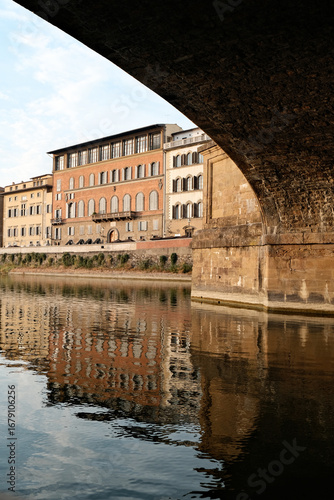 Under a bridge in Florence at sunset