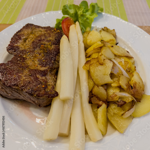 Wallpaper Mural Steak with asparagus and fried potatoes on white plate Torontodigital.ca