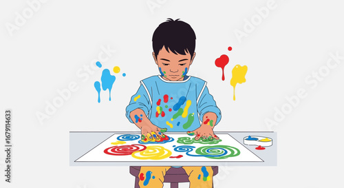 Young boy having fun creating art using paint and his hands on a paper