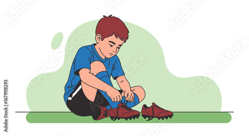 Young boy putting on his soccer cleats ready for the game on the field